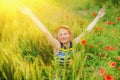 Portrait of beautiful very happy blonde woman in a wheat field in summer sun`s rays. Horizontal image Royalty Free Stock Photo