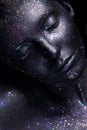 Portrait of beautiful woman with art space makeup on her face and body. Glitter Face. Royalty Free Stock Photo