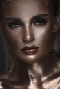 Portrait of beautiful woman with art space makeup on her face and body. Glitter Face. Royalty Free Stock Photo