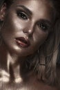 Portrait of beautiful woman with art space makeup on her face and body. Glitter Face. Royalty Free Stock Photo