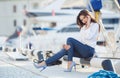 Portrait of a beautiful woman on the background of the sea and yachts Royalty Free Stock Photo