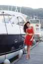 Portrait of a beautiful woman on the background of the sea and yachts Royalty Free Stock Photo