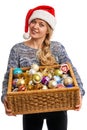 Portrait of a beautiful woman with a basket of Christmas ornaments
