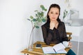 Portrait of beautiful woman in black blouse, with cup Royalty Free Stock Photo