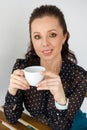 Portrait of beautiful woman in black blouse, with cup Royalty Free Stock Photo