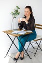 Portrait of beautiful woman in black blouse, with cup Royalty Free Stock Photo