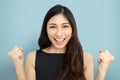 Portrait of beautiful woman in black cloth with victory, winner, success poses. Excited Attractive Asian Businesswoman celebrating Royalty Free Stock Photo