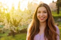 Portrait of beautiful woman with blooming trees in spring Royalty Free Stock Photo