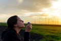 Portrait of beautiful woman blowing bubbles in park Royalty Free Stock Photo