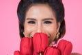 Beautiful woman with bouquet of red tulip flowers Royalty Free Stock Photo