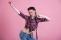 Portrait of a beautiful fashionable woman with braids in a country shirt Royalty Free Stock Photo