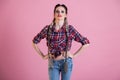 Portrait of a beautiful fashionable woman with braids in a country shirt Royalty Free Stock Photo