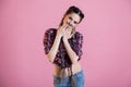 Portrait of a beautiful fashionable woman with braids in a country shirt Royalty Free Stock Photo