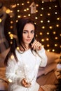 Portrait of a beautiful woman in the Christmas decorations, festive mood Royalty Free Stock Photo