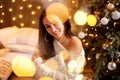 Portrait of a beautiful woman in the Christmas decorations, festive mood Royalty Free Stock Photo