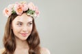 Portrait of beautiful woman with clear skin and flowers on white. Natural beauty Royalty Free Stock Photo