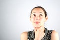 Portrait of a beautiful woman cogitate isolated on a white background