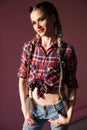 Portrait of a beautiful fashionable woman with country shirt braids Royalty Free Stock Photo