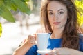 Portrait of beautiful woman drinking coffe in a coffee shop Royalty Free Stock Photo