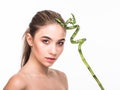 Portrait beautiful woman face portrait with green leaf , concept for skin care or organic cosmetics Royalty Free Stock Photo