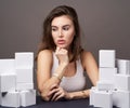 Portrait of beautiful woman with a gifts on grey background with copy space