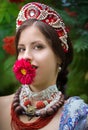 Ethnic russian national costume woman with a flower at ÃÅÃâ°ÃÂ³ÃÂµÃâ¬ Royalty Free Stock Photo