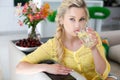 Portrait of a beautiful woman with a glass of water in the kitchen Royalty Free Stock Photo