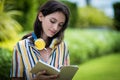 Portrait of a beautiful woman has reading a book with smiling and relax in the garden Royalty Free Stock Photo