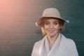 Portrait of a beautiful woman in a hat and coat outdoor . Royalty Free Stock Photo