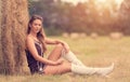 Portrait of a beautiful woman with hay bale Royalty Free Stock Photo