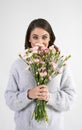 Portrait of beautiful woman holding bunch of flowers Royalty Free Stock Photo