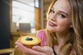 Portrait of beautiful woman holding cupcake Royalty Free Stock Photo