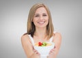 Portrait of beautiful woman holding fruit bowl Royalty Free Stock Photo