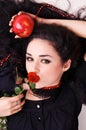 Portrait of a beautiful woman holding a red apple Royalty Free Stock Photo