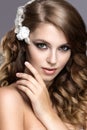 Portrait of a beautiful woman in the image of the bride with flowers in her hair. Beauty face Royalty Free Stock Photo