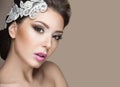 Portrait of a beautiful woman in the image of the bride with lace in her hair. Beauty face