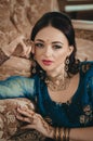 portrait of a beautiful woman in Indian traditional Chinese dres