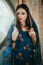 portrait of a beautiful woman in Indian traditional Chinese dres