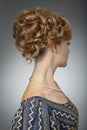 Portrait of a beautiful woman. Natural beauty. Updo. Rear view. Royalty Free Stock Photo