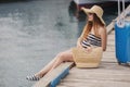 Portrait of beautiful woman on a pier near the sea Royalty Free Stock Photo