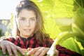 Portrait of a beautiful woman among the plants concept of ecology peace and freedom