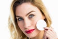 Portrait of beautiful woman posing with make-up sponge