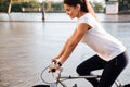 Portrait of a beautiful woman riding on bicycle