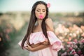Portrait of beautiful woman with rose flower in her mouth Royalty Free Stock Photo