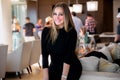 Portrait of a beautiful woman smiling at a social gathering celebration, possibly a company work party or holiday event