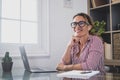 Portrait of beautiful woman smiling and talking to a man next to her talking about business work together in the office. Royalty Free Stock Photo