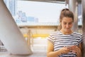 Portrait beautiful woman using cell phone and walking in the center street city,Happy and smiling,Female with positive attitude ex Royalty Free Stock Photo