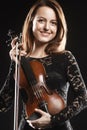 Portrait of beautiful woman with violin