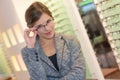 Portrait beautiful woman wearing glasses in optician store Royalty Free Stock Photo