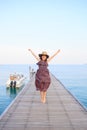 Portrait of beautiful woman wearing long dress and wide straw ha Royalty Free Stock Photo